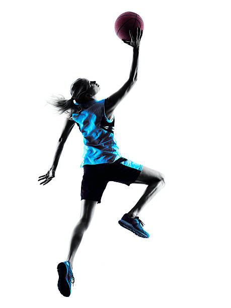 femme silhouette de joueur de basket-ball - womens basketball photos et images de collection