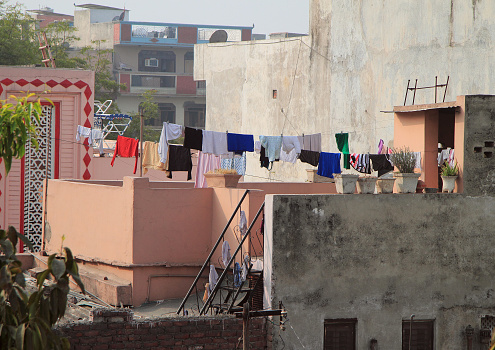 balcony in some poor district of Delhi, India