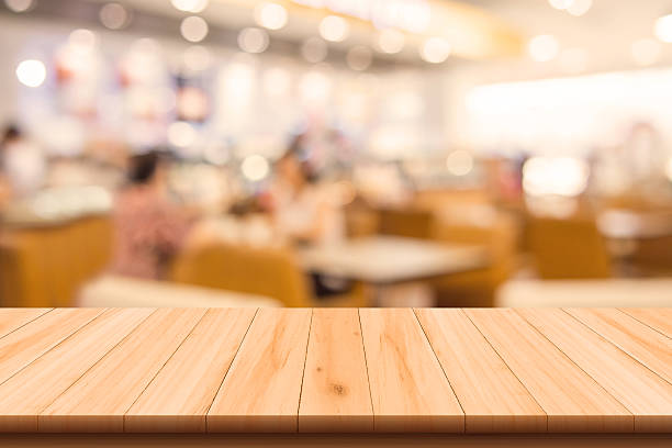 Restaurant and Coffee shop blurred background with wooden floor stock photo