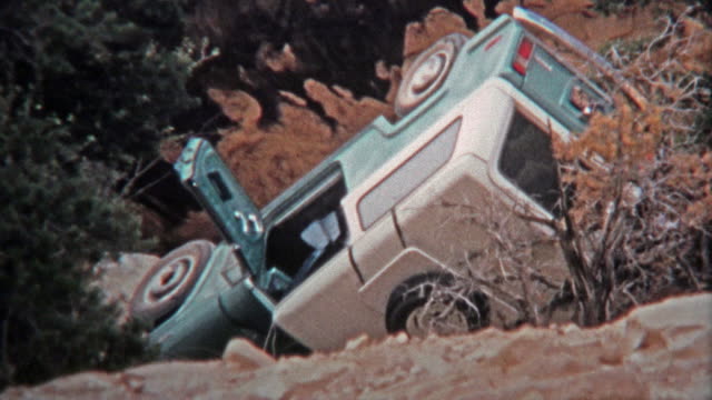 CANYONLANDS, UTAH -1971: Crashed Jeep automobile and flipped over from technical offroad trails.