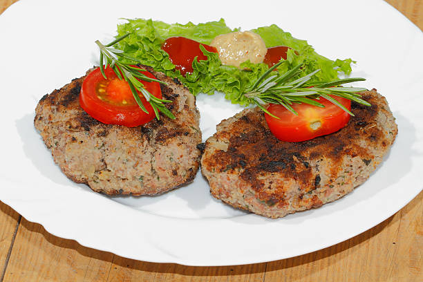istock Grilled beef patties, spicy sauces, plates 484009706