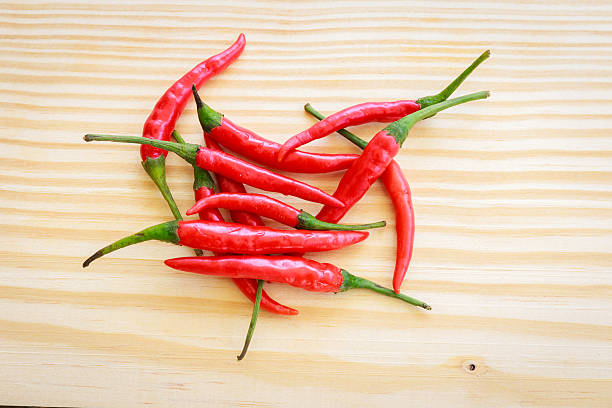istock Chili on the wood 484009970