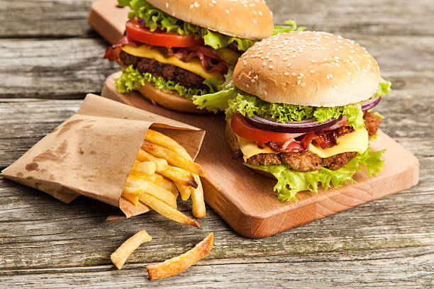istock Delicious hamburger and fries 484012032
