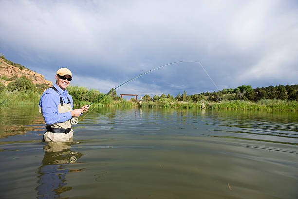 istock Happy Fly Fisherman in Stillwater Pond 484014351