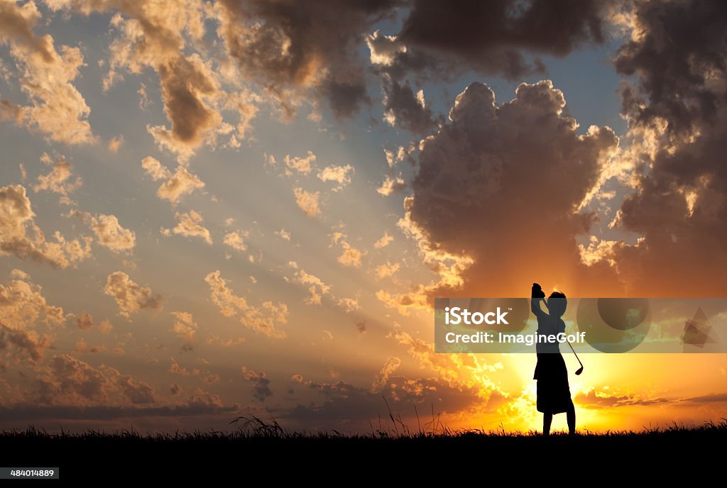 Junior Golfer Silhouette A junior golfer at sunset. Horizontal colour image. Silhouette. Golf theme. A young junior level athlete on a golf course swinging a golf club against a beautiful sunset sky. Golfer is approximately 10 years old in the image. Image taken in rural setting on golf course in the Canadian prairies. Model is unrecognizable.  Golf Stock Photo