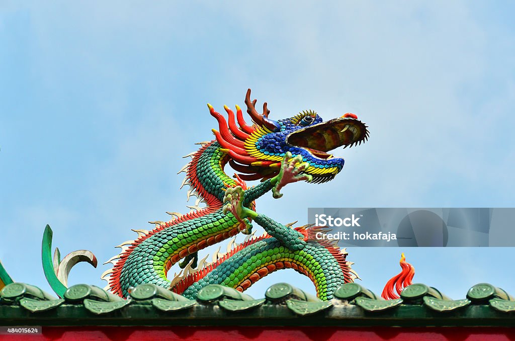 Colorful dragon on a temple Myanmar. This colorful dragon is on the rooftop of the Kheng Hock Keong Buddhist  Temple in China Town in Yangon./	Dragon on the roof of a Chinese temple in Yangon, Myanmar 2015 Stock Photo