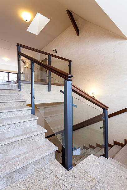 istock Staircase with stone steps and glass banister 484016615