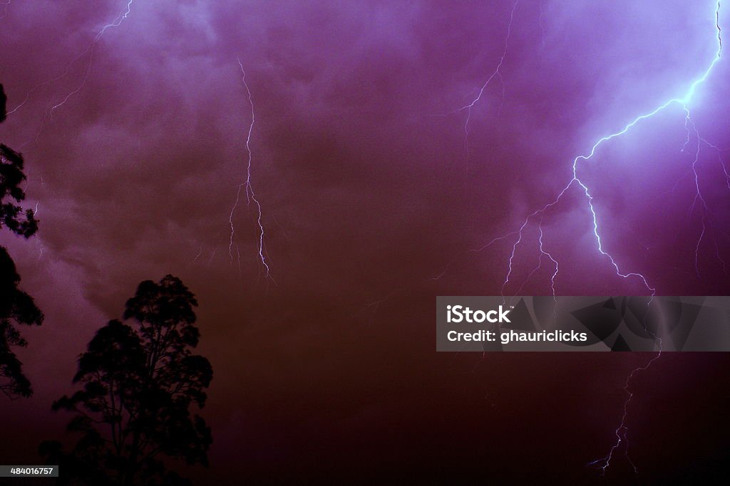 Lightning Strike in red Red Clouds Filled with Thunders Awe Stock Photo