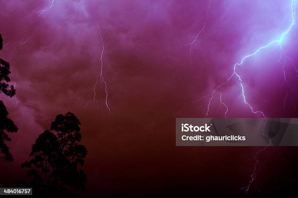 Lightning Strike In Red Stock Photo - Download Image Now - Awe, Bizarre, Bright