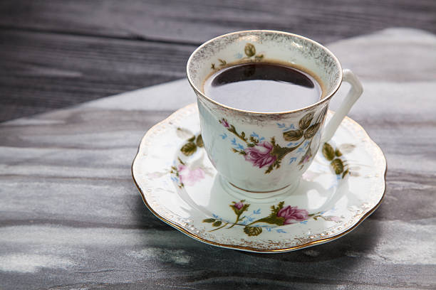 istock Cup of coffee on a marble table 484019646