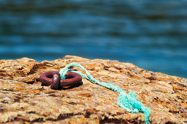 istock Closeup of Iron Ring embedded in rock 484020794