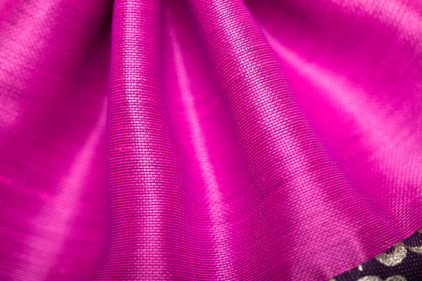 istock Magenta silk folds or pleats up close 484021436