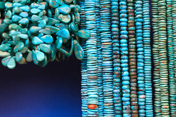 istock Turquoise Beads and Necklaces Hanging in Shop (Close-Up) 484022848
