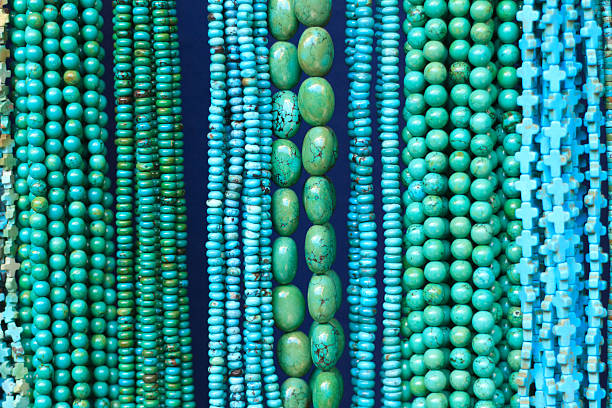 istock Turquoise Beads and Necklaces Hanging in Shop (Close-Up) 484022904