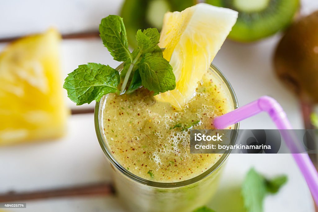 Smoothies of kiwi and pineapple on the table. Top view 2015 Stock Photo