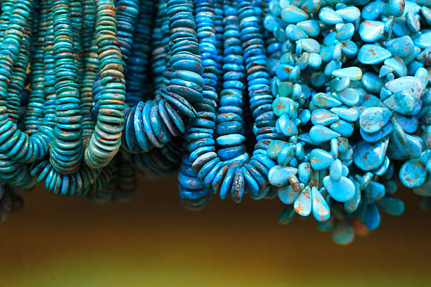 istock Turquoise Beads and Necklaces Hanging in Shop (Close-Up) 484026286