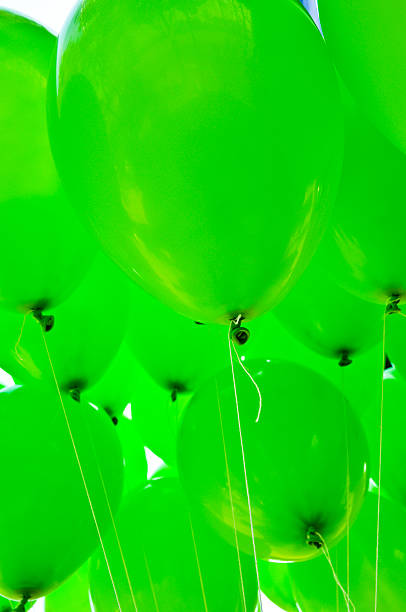 istock Stock image of green balloons floating 484026856