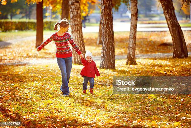 Happy Family Mother And Child Little Daughter On Autumn Walk Stock Photo - Download Image Now