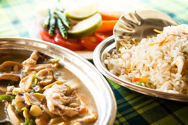 istock Indian cuisine. Sliced chicken with mushrooms and vegetable biryani. 484028062