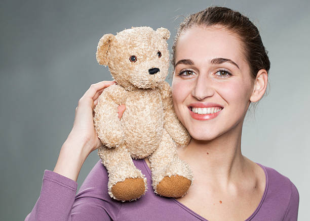 istock cheerful 20s girl holding her favorite comforter with emotion 484028238
