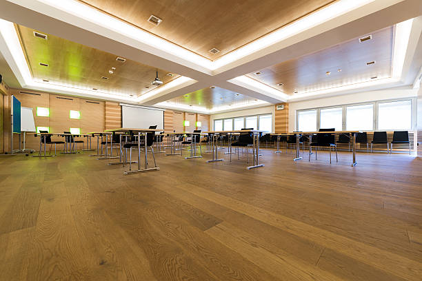 istock low view in wooden class or conference room with desks 484030889