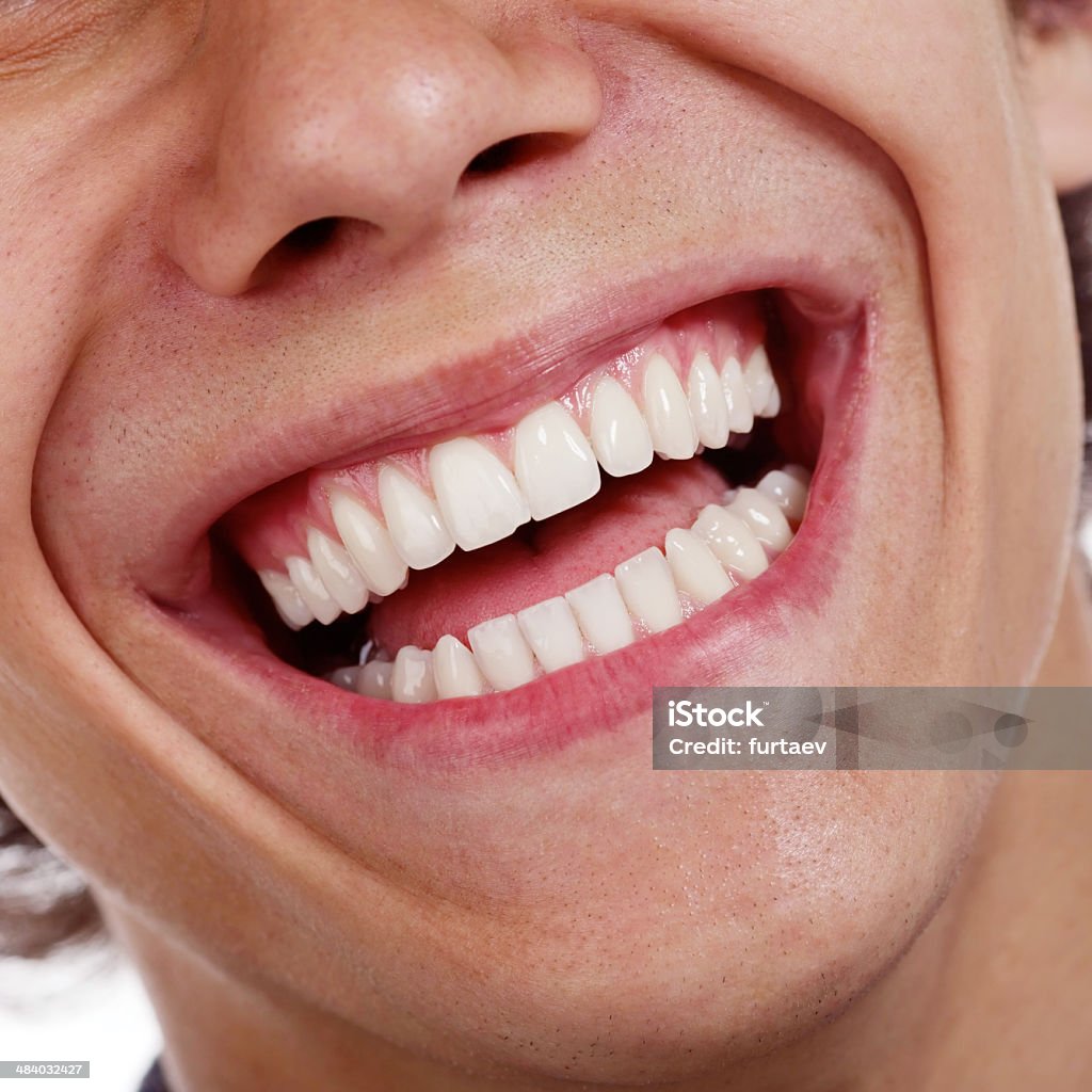 Healthy teeth closeup Closeup shot of awesome healthy teeth over white background Close-up Stock Photo
