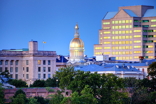 The New Jersey State House along the Delaware River is located in Trenton and is the house of government for the U.S. state of New Jersey.