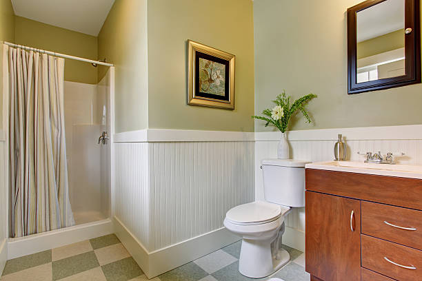 istock Bathroom with checkered tile floor, and green white walls. 484033166