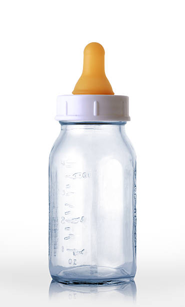 empty baby bottle empty baby bottle on white. baby bottle stock pictures, royalty-free photos & images