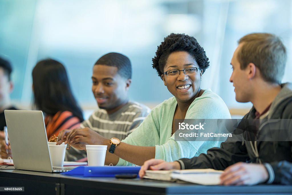 Students Diverse group of college students in class. Laptop Stock Photo