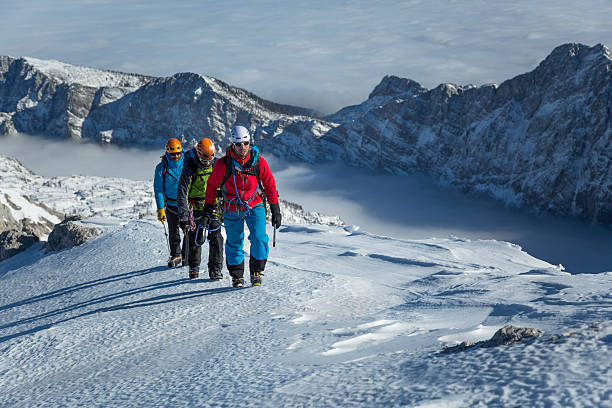 istock Men hiking on snow covered landscape 484033696