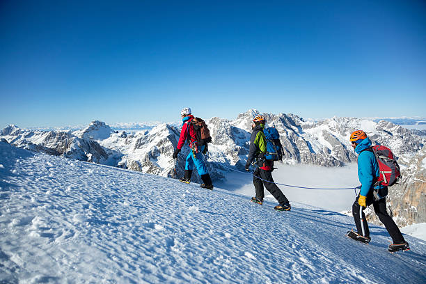 istock Men hiking on snow covered landscape 484033720