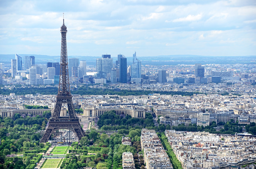 Aerial view of Paris with Champ-de-Mars, Eiffel Tower and skyscrapers of La Defense