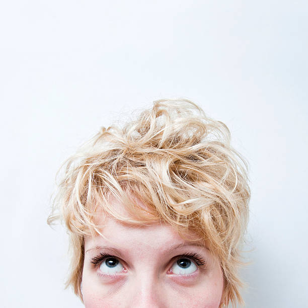 istock Tired Blond Girl Looking Up 484034555