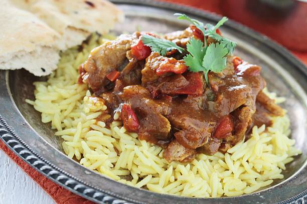 istock plated chicken curry mealwith pilau rice 484035194