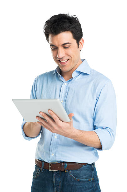 feliz joven usando tableta digital - mid adult men smart casual white happiness fotografías e imágenes de stock