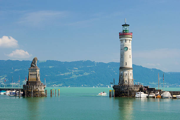 Lindau Lighthouse and Bavarian Lion Lighthouse and Bavarian Lion in harbor of Lindau in Lake Constance, Germany. lindau lighthouse stock pictures, royalty-free photos & images