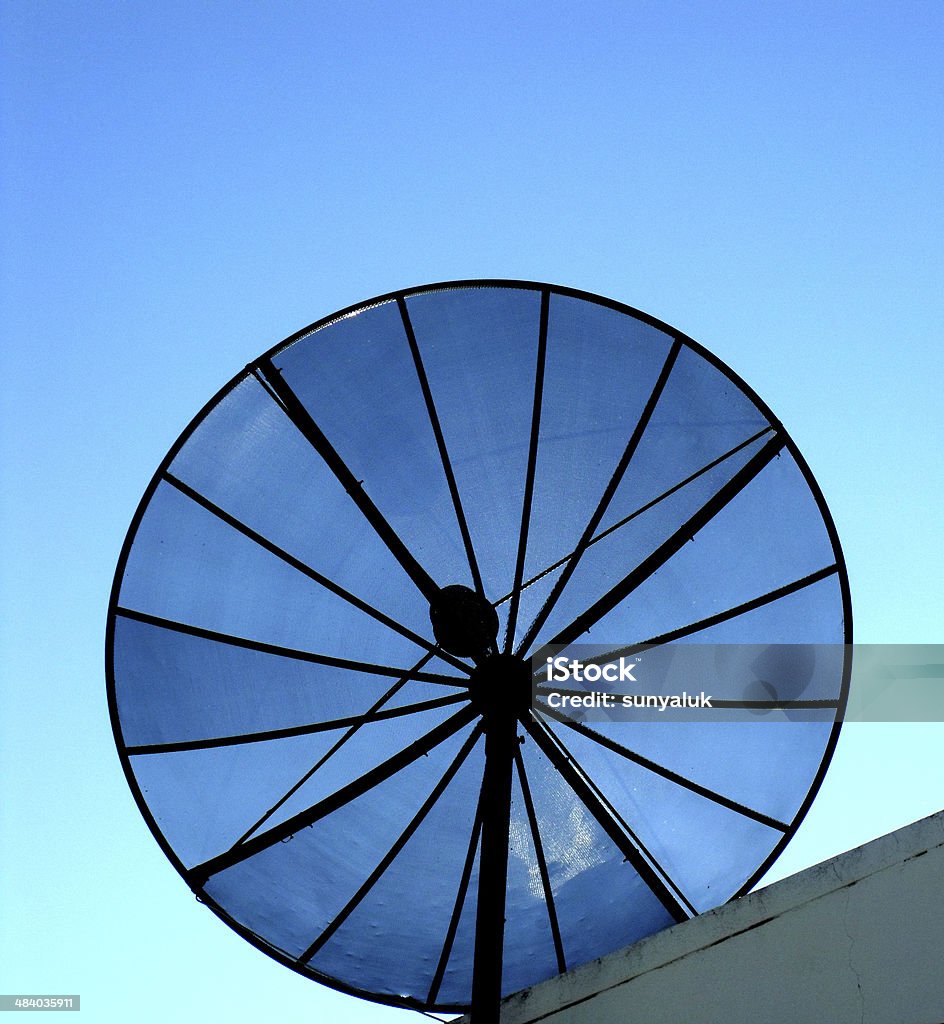 House satellite antenna The big black satellite antenna on the house 's roof. Angle Stock Photo