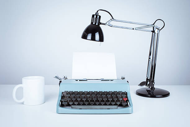 istock vintage typewriter and desk with lamp 484037031
