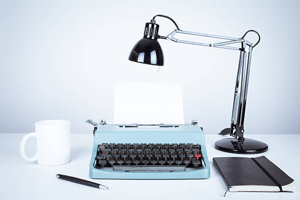 istock vintage typewriter and desk with lamp 484037303