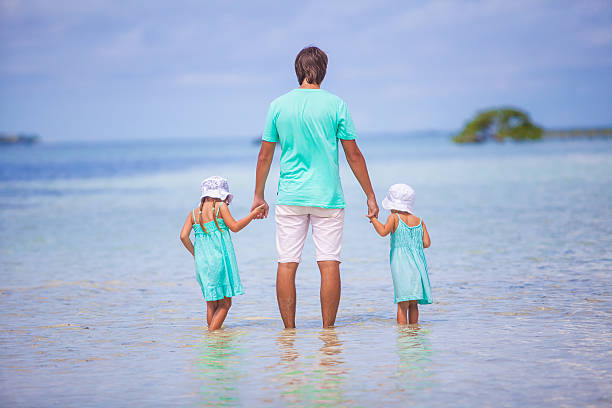 istock Father and his two adorable daughters on an exotic vacation 484037891