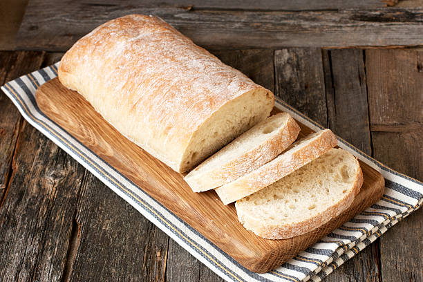 istock Sliced Ciabatta on wooden board 484039456