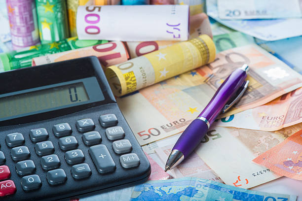 istock Calculator and pen on a money background 484040040