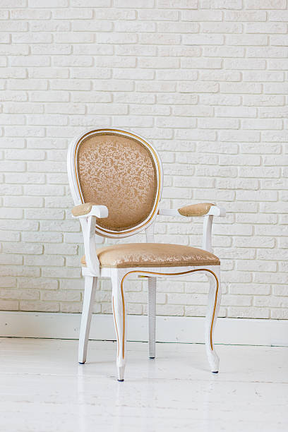 istock Luxury Golden Vintage Chair On Brick Wall 484041488
