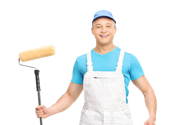 istock Male house painter holding a paint roller isolated on white 484041924