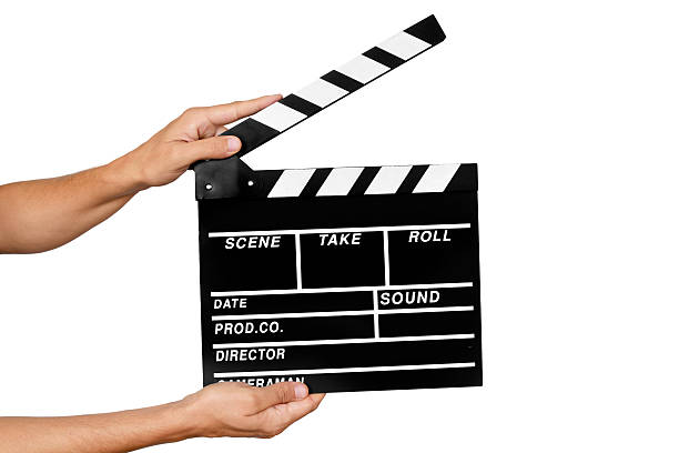 istock young man with a traditional wooden clapperboard 484042134