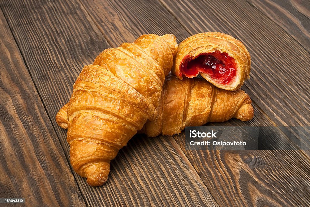 Croissants on a wooden table Croissant Stock Photo