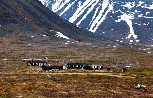 istock Cottage under big, partially snowy mountain 484047680