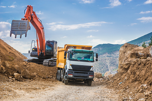 Excavator loading dumper truck 