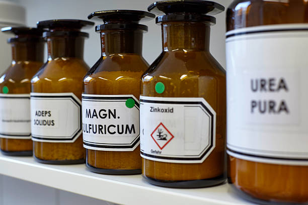 istock Transparent brown glass jars  in a pharmacy shelf 484049926